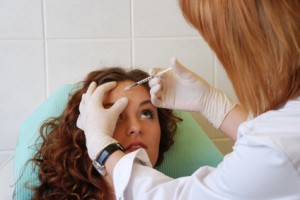 nurse injecting patient