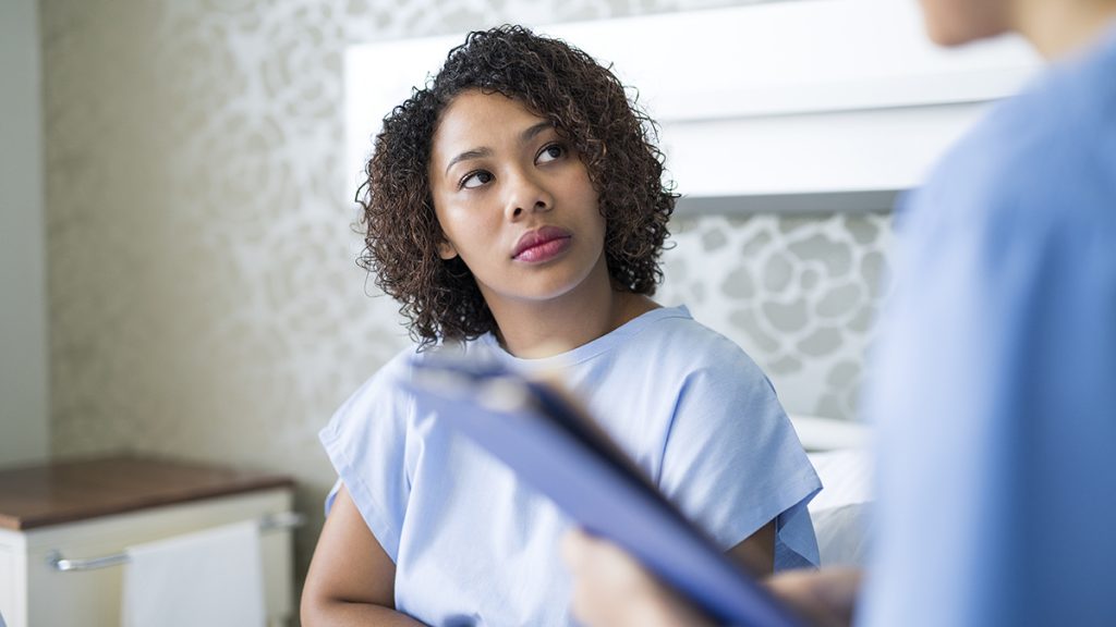 concerned patient with doctor in consultation