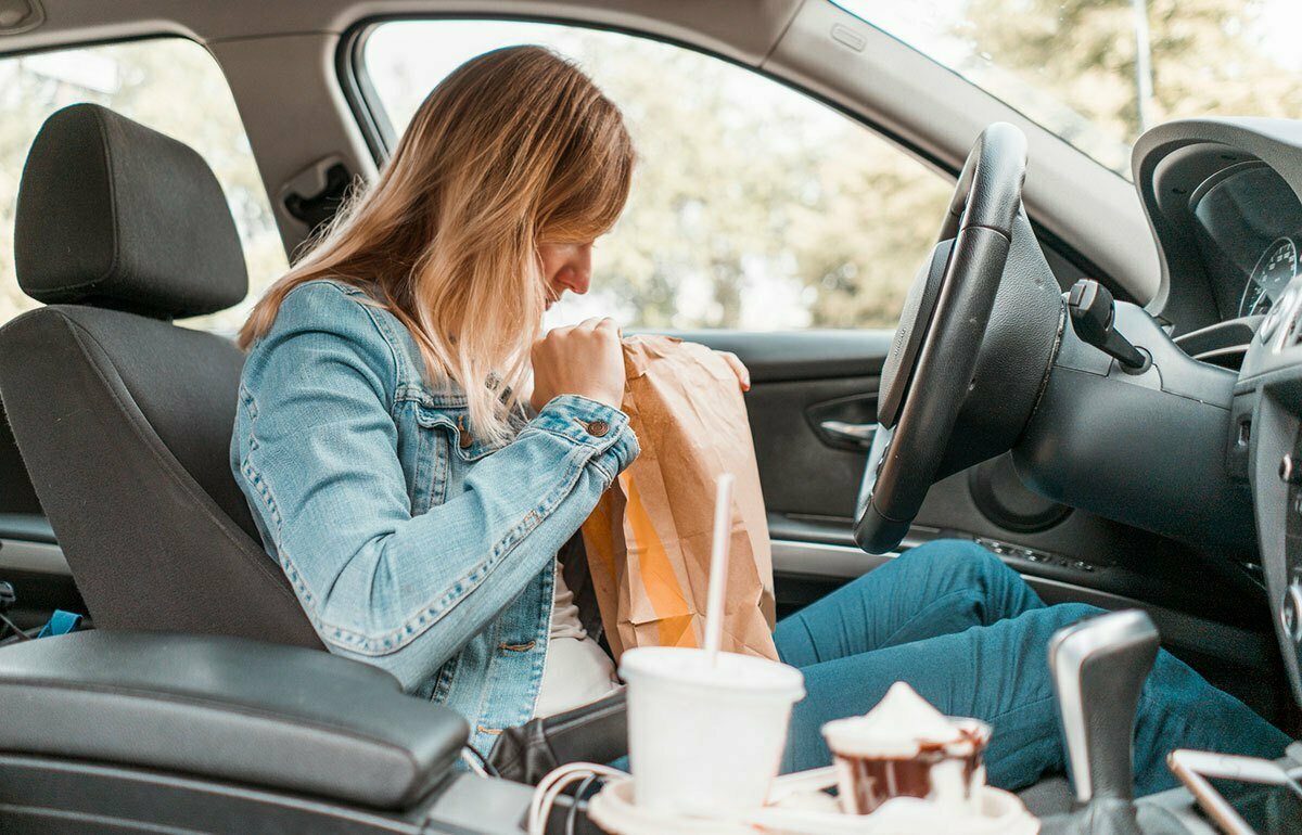 woman eats processed foods that may lead to premature aging