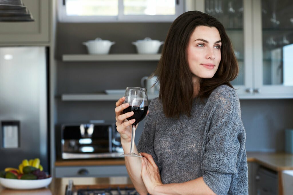 Woman Enjoys Glass of Wine
